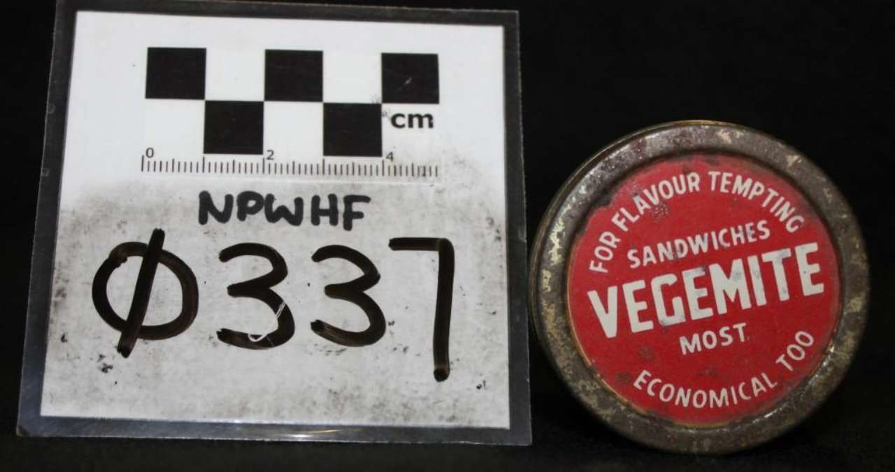 Black-and-white measurement card labeled “NPWH Φ337” beside a red Vegemite jar lid.