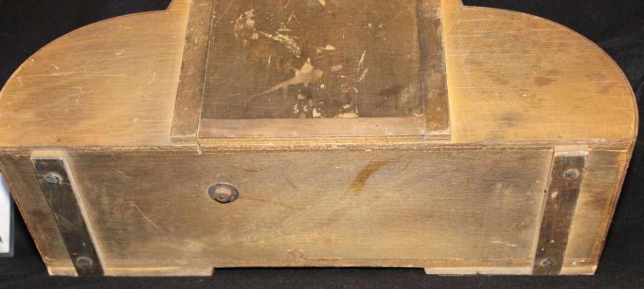 Wooden vintage trunk with metal corner reinforcements and a worn top panel