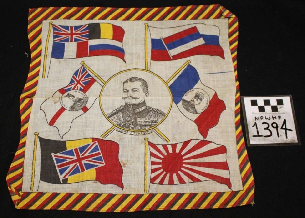 Patchwork with flags and a central portrait, bordered in red and yellow diagonal stripes