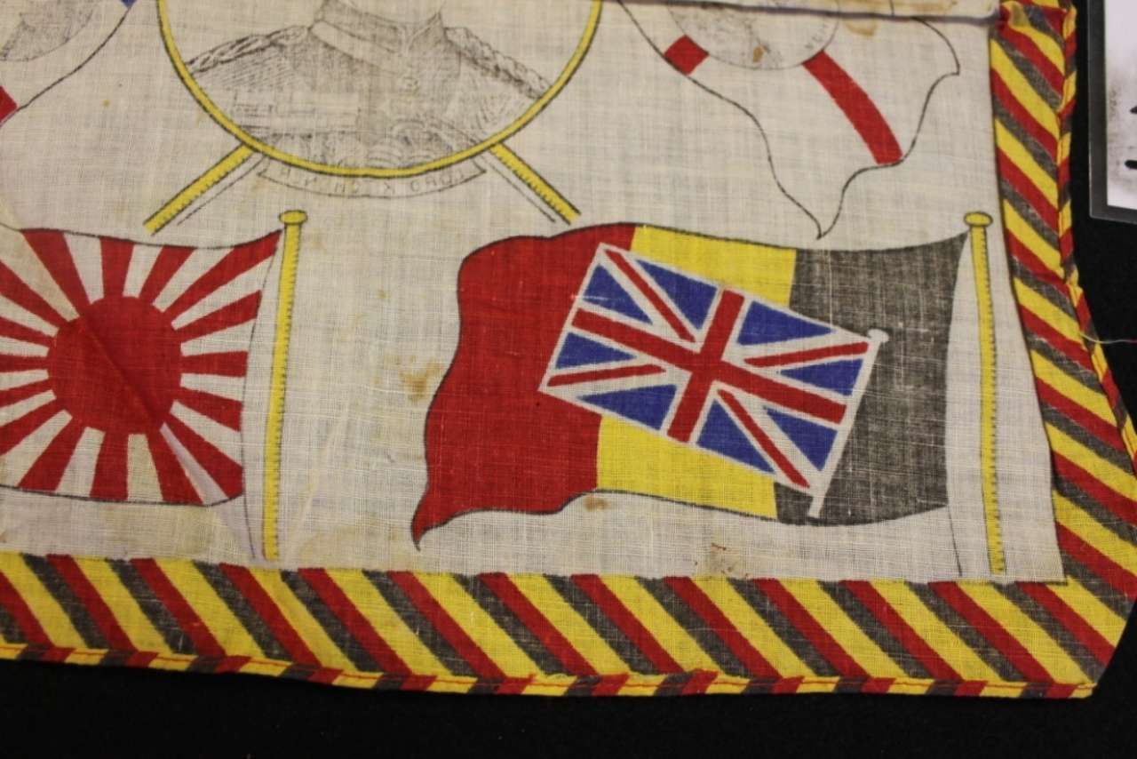 Japanese and British naval flags on a striped fabric background