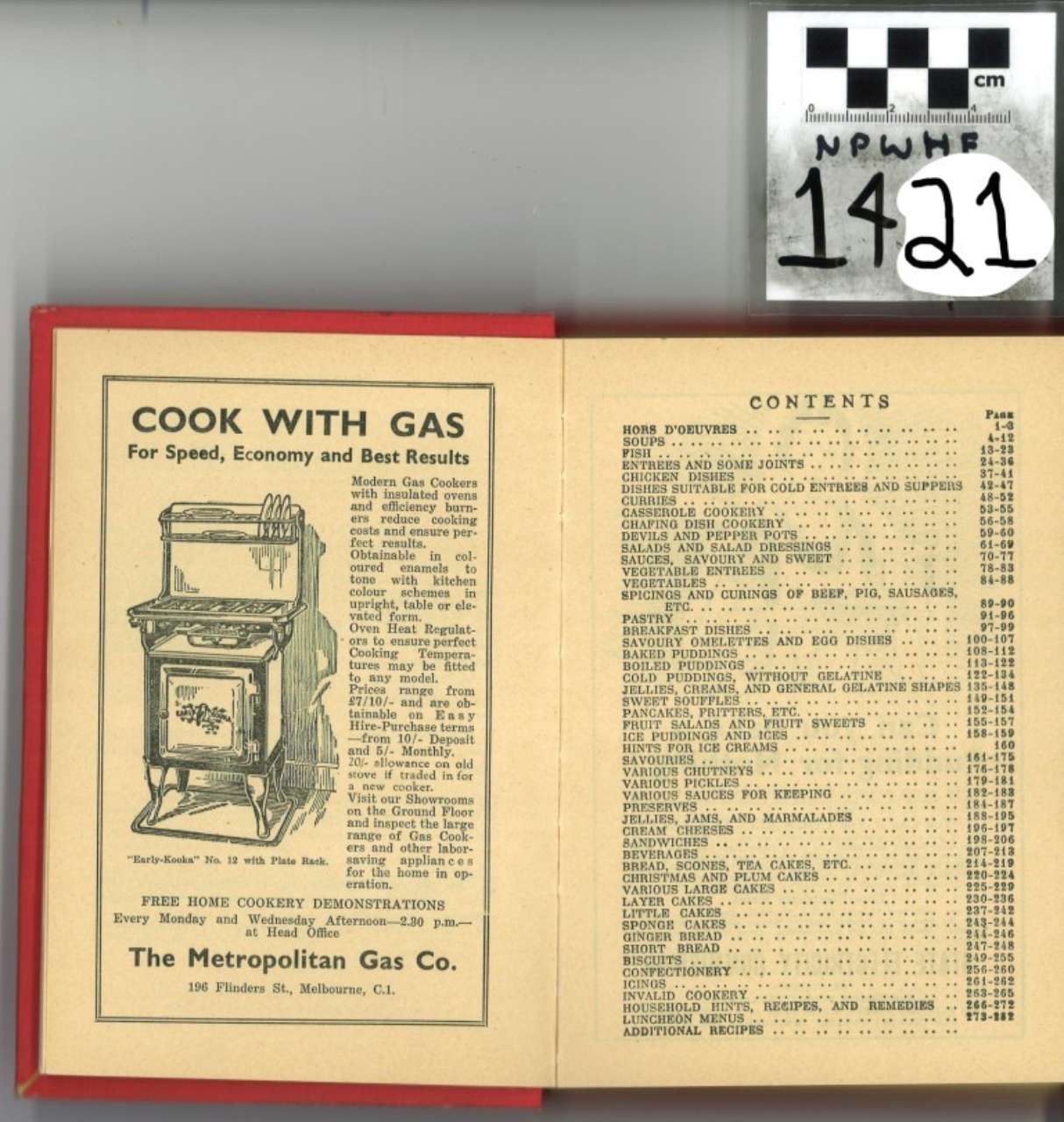 Open cookbook with red cover, showing “Cook with Gas” ad and contents page; archive label above