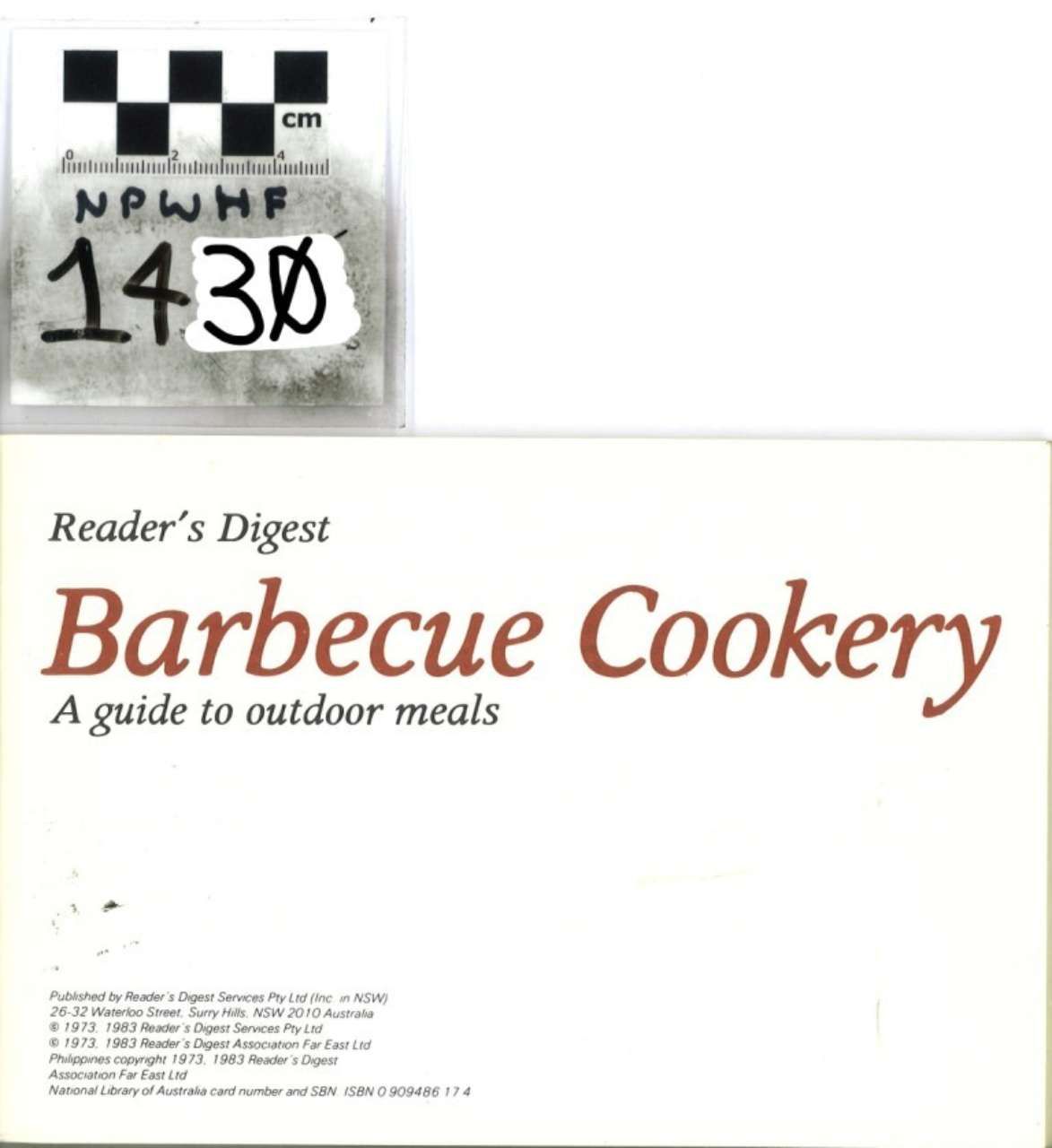 Reader’s Digest “Barbecue Cookery” cookbook cover with white background and black handwritten library label