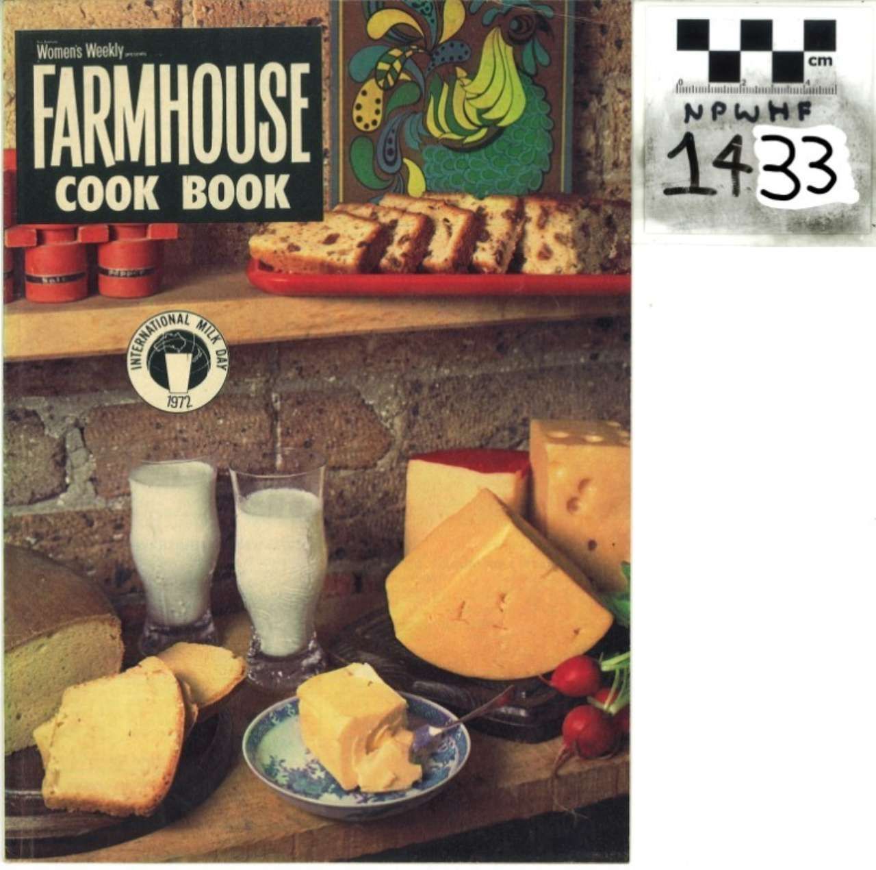 Farmhouse cook book cover with cheeses, milk, bread, and a small price tag reading 1433