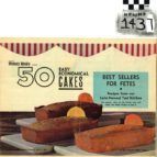 Vintage 1950s cake mix box with three loaf cakes and red-striped branding, labeled “Best Sellers for Pets.”