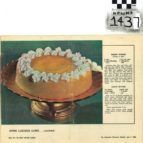 Vintage magazine page showing a frosted ring cake on a pedestal stand with a recipe text block on the right
