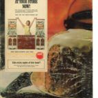 Ad poster beside a glass bottle with a large crack, featuring a small inset of a person with raised arms.