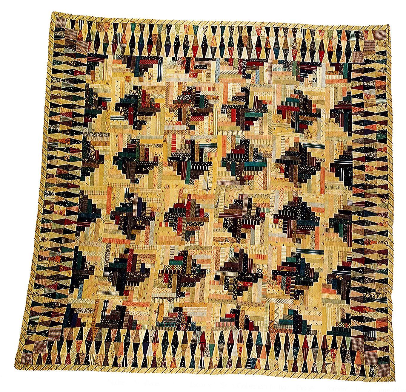 Geometric woven rug in cream, black, red, and gold with repeating patterned border.