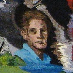 Portrait of a person with a blue shirt against a dark background
