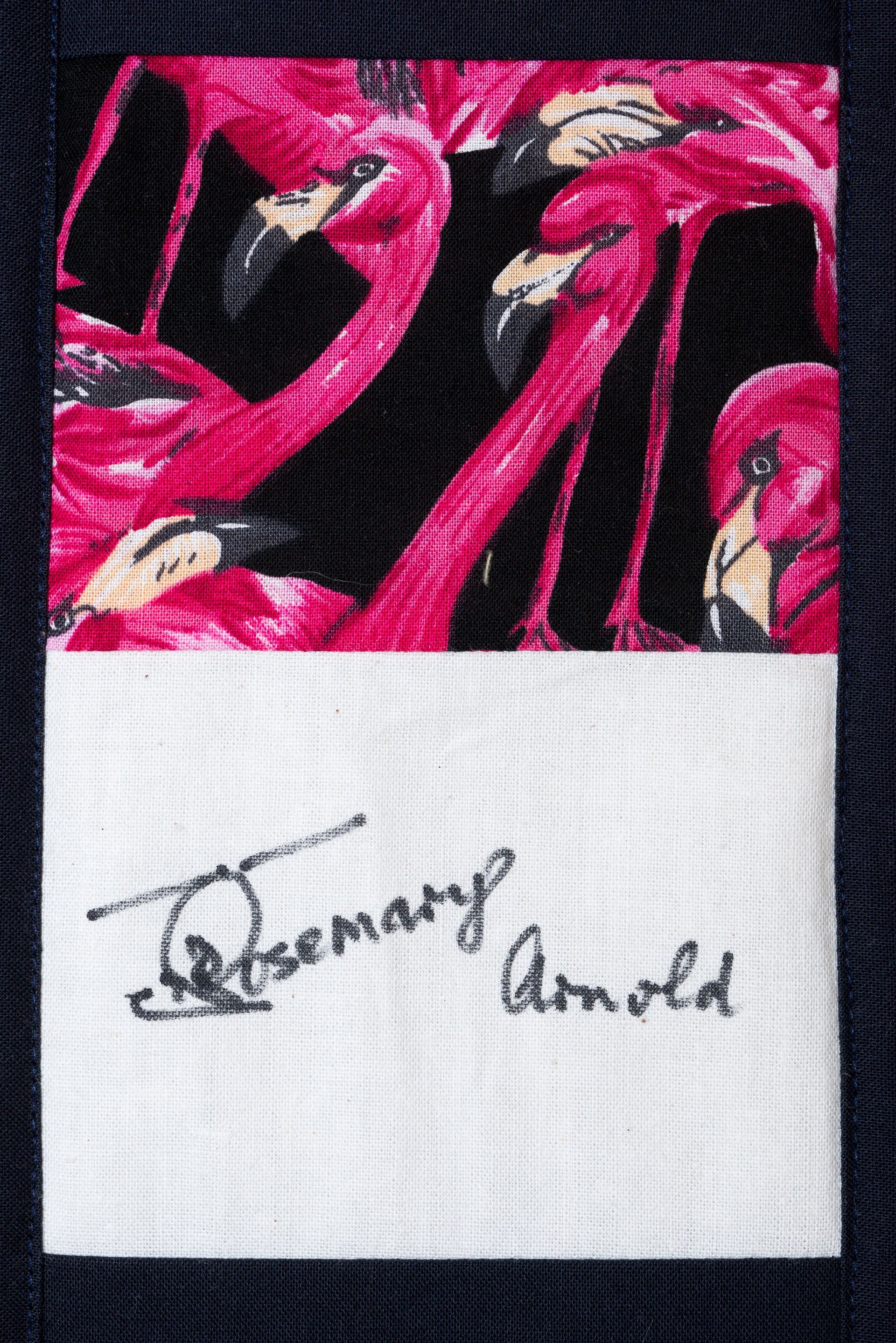 Abstract pink and black painting above a white label reading “Rosemary Arnold”