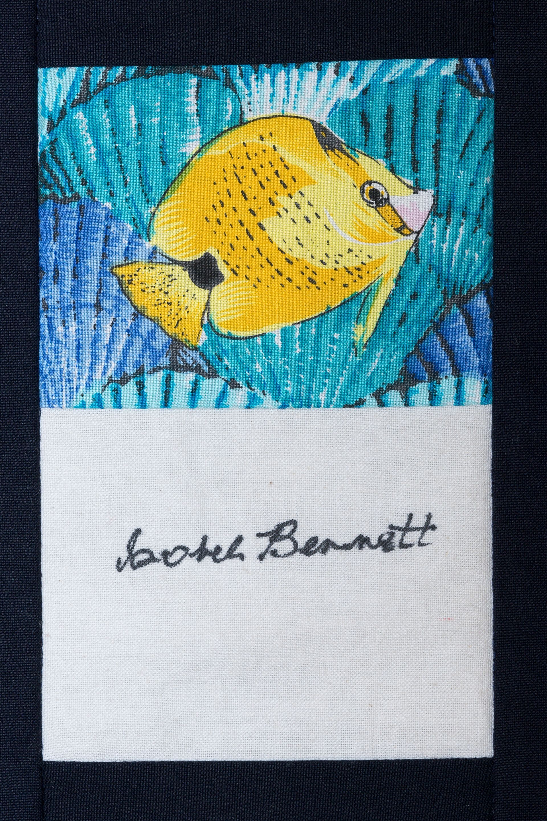 Yellow fish artwork on blue background above a white panel with a black signature