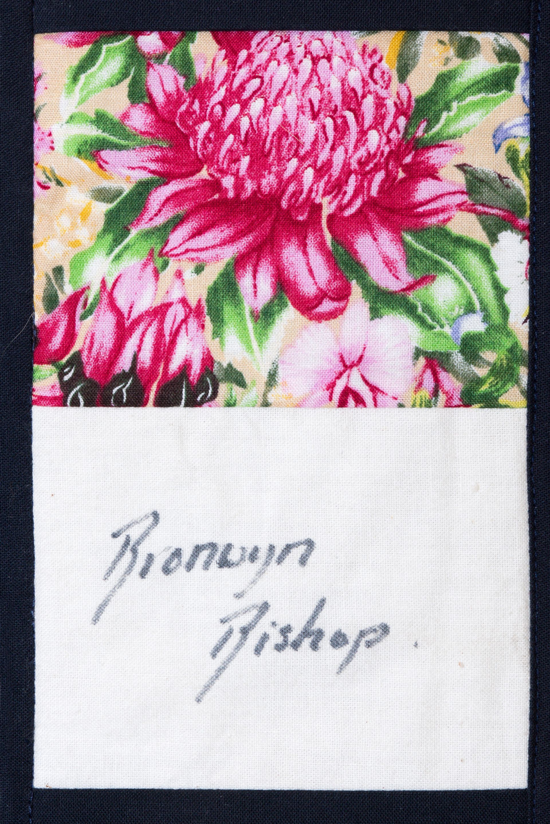 White card with handwritten “Bromton Bishop” beneath a pink floral fabric swatch