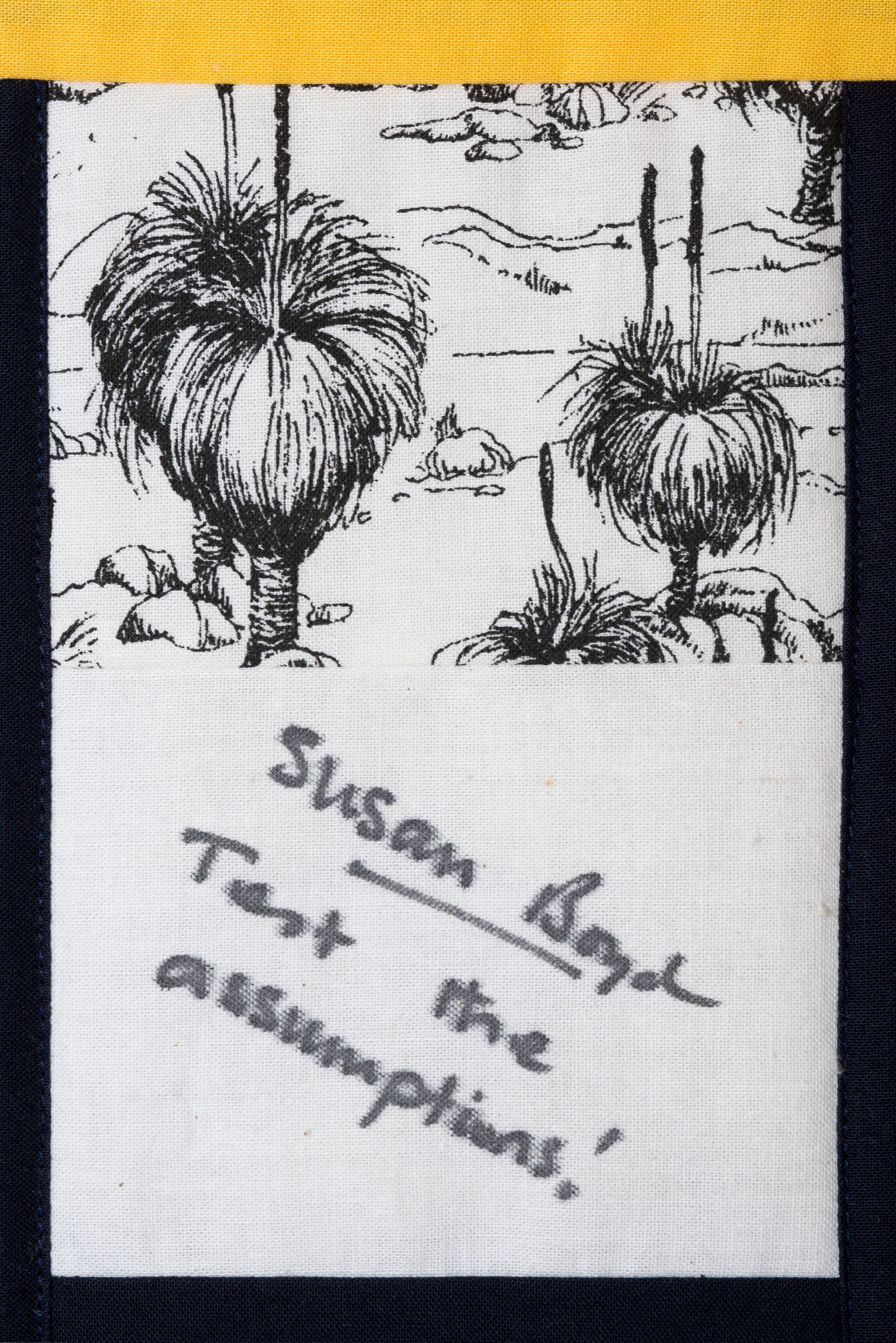 Two spiky plants sketched in black ink with handwritten note on a white card.