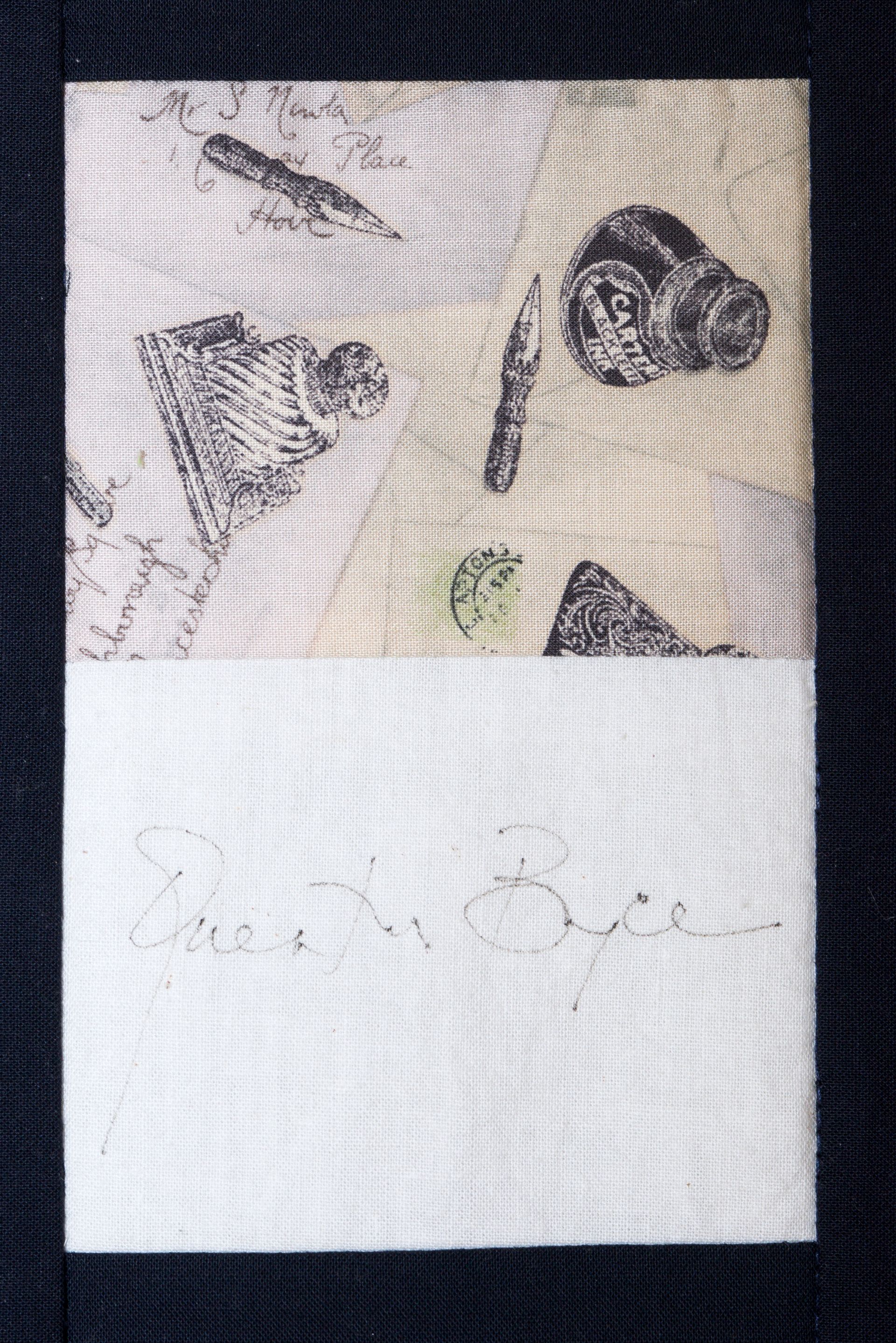Two butterfly prints on white fabric, partly covered by a white strip with faint pencil writing