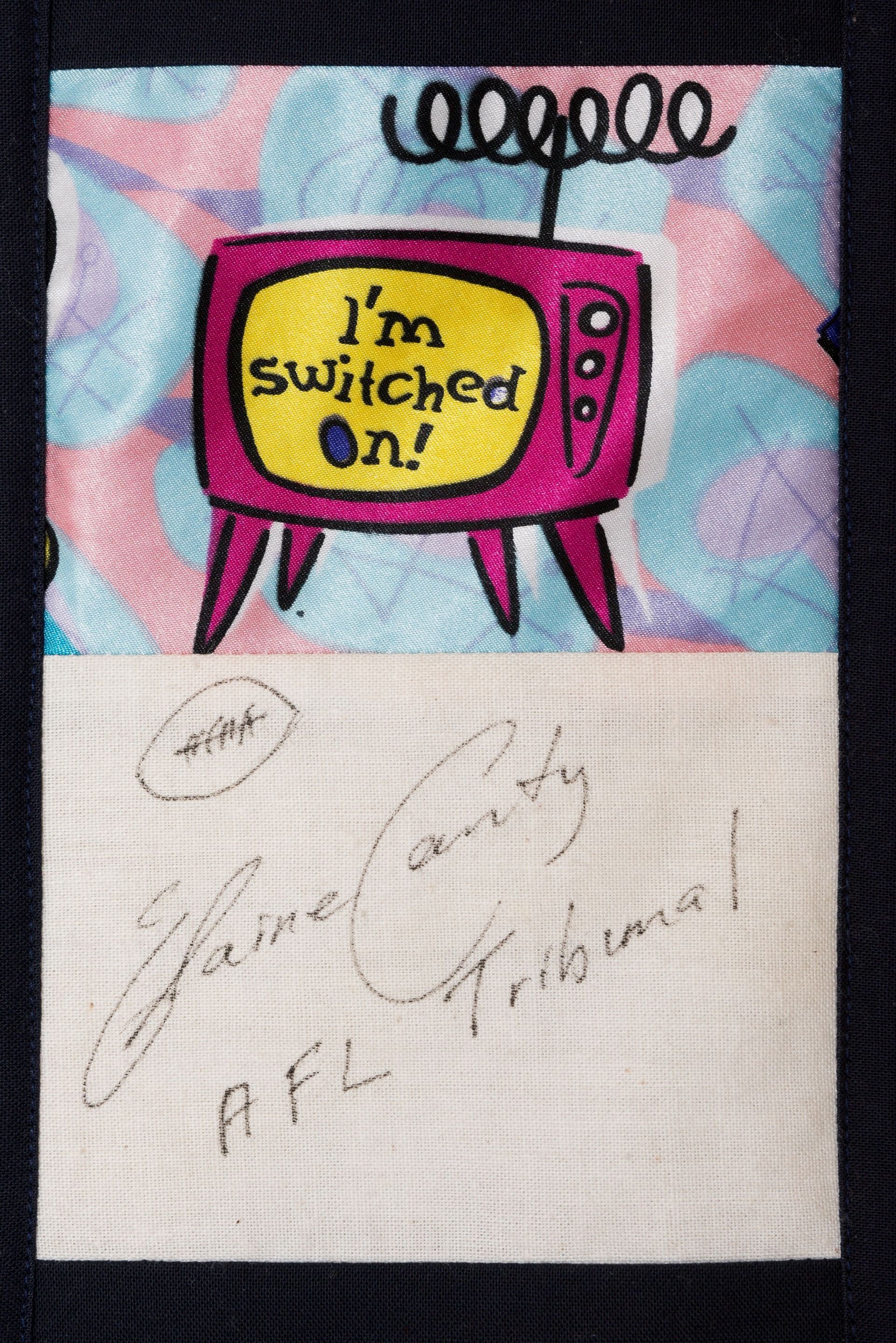 Pink cartoon TV with “I’m switched on!” on a pastel background, above a signed white card.