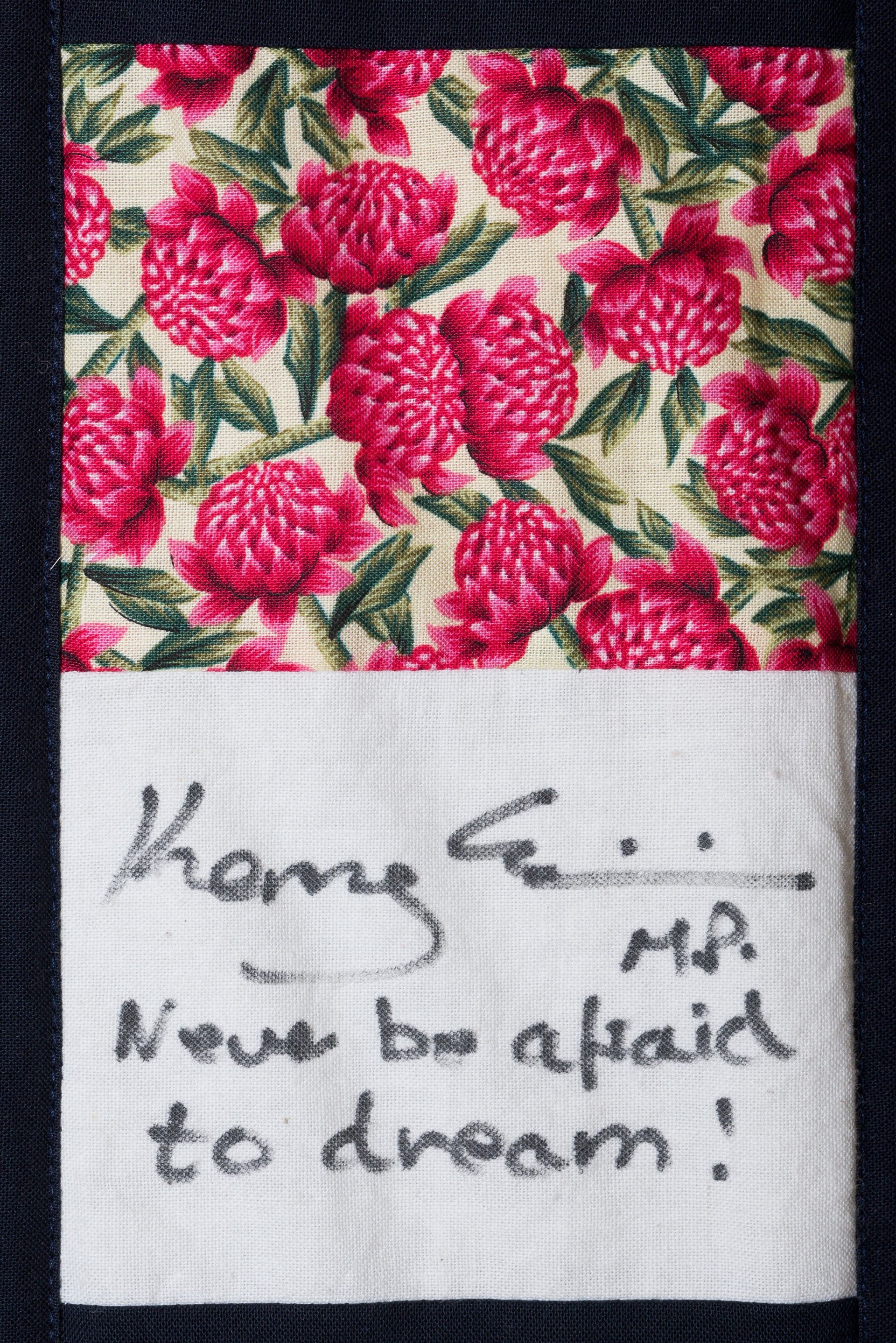 Floral fabric with handwritten message: “Never be afraid to dream!”