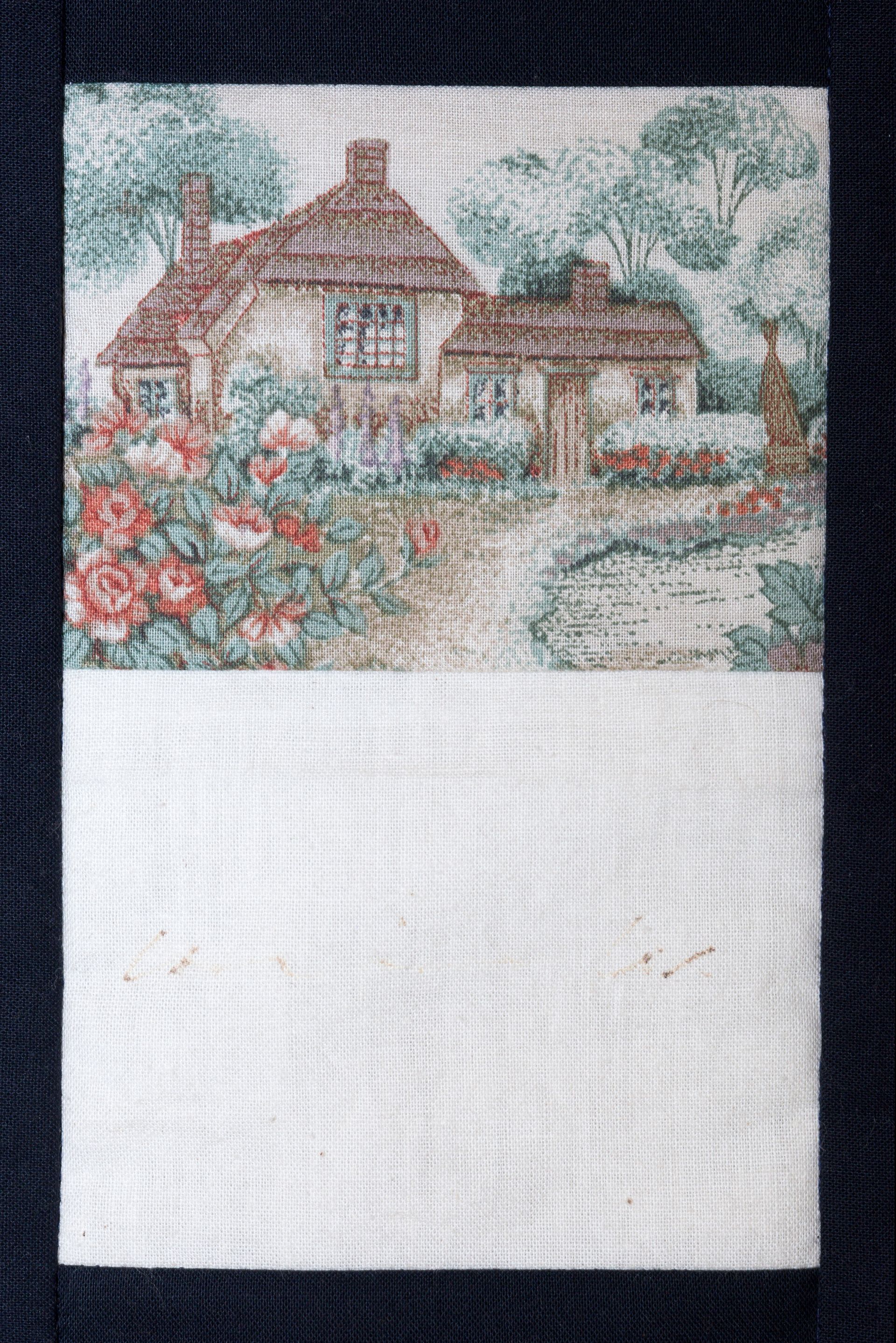 Cross-stitched cottage garden with flowers and trees on white fabric