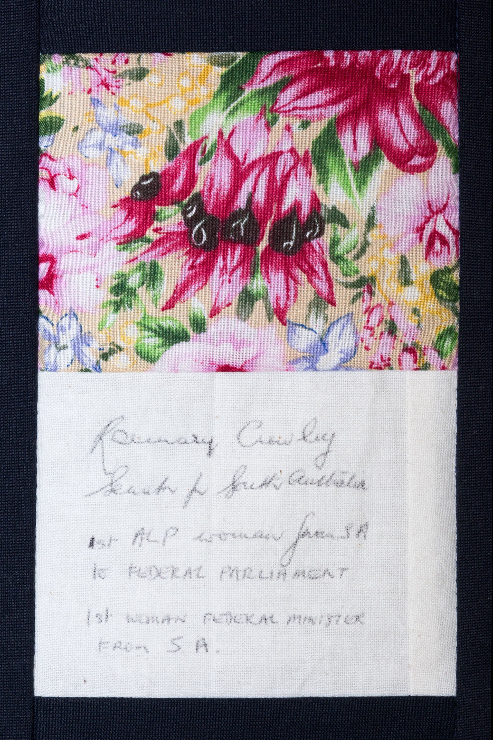 Floral fabric notebook with a handwritten white label on the front cover