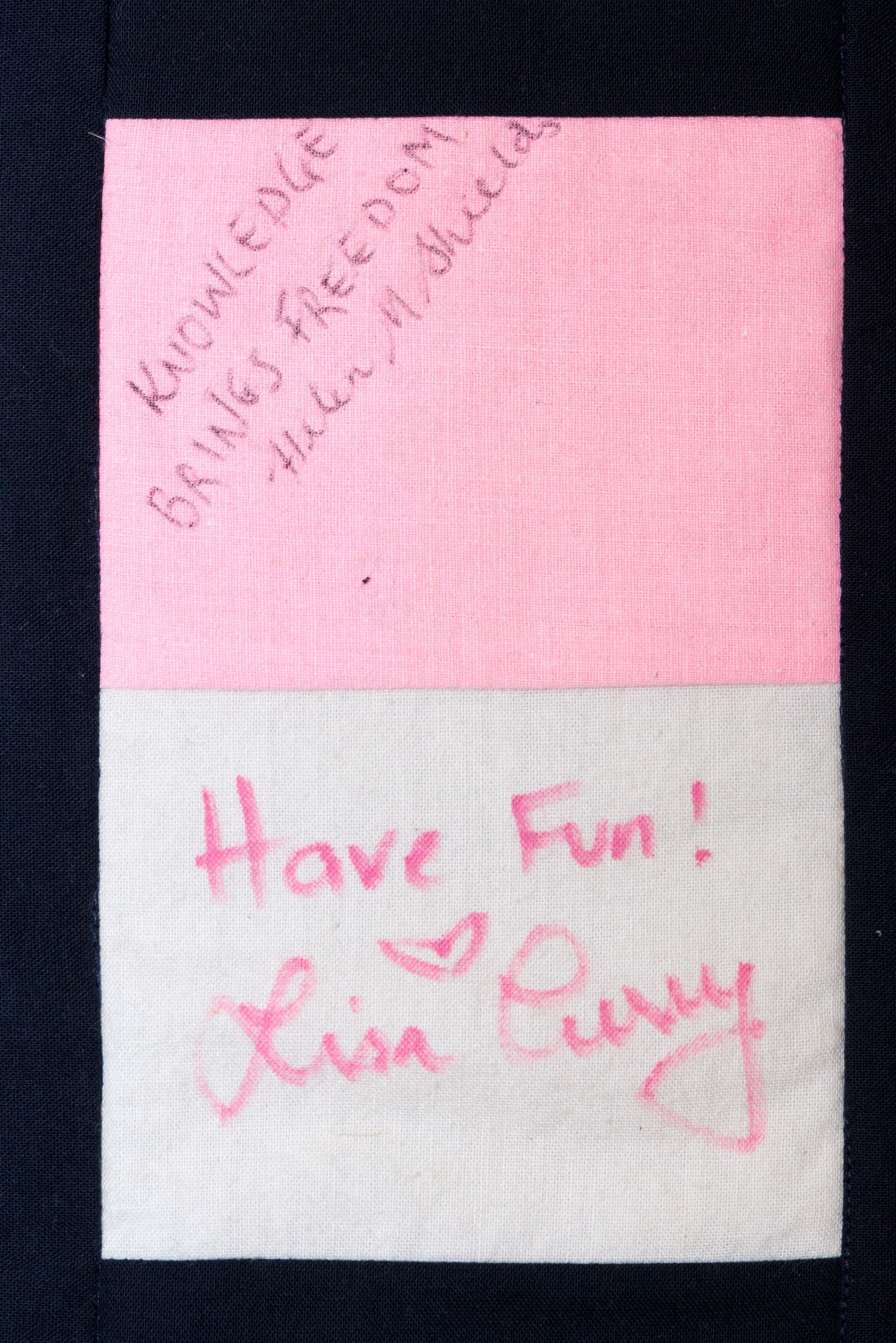 Pink and white note with handwritten message: “Have Fun! Love, Lucy.”