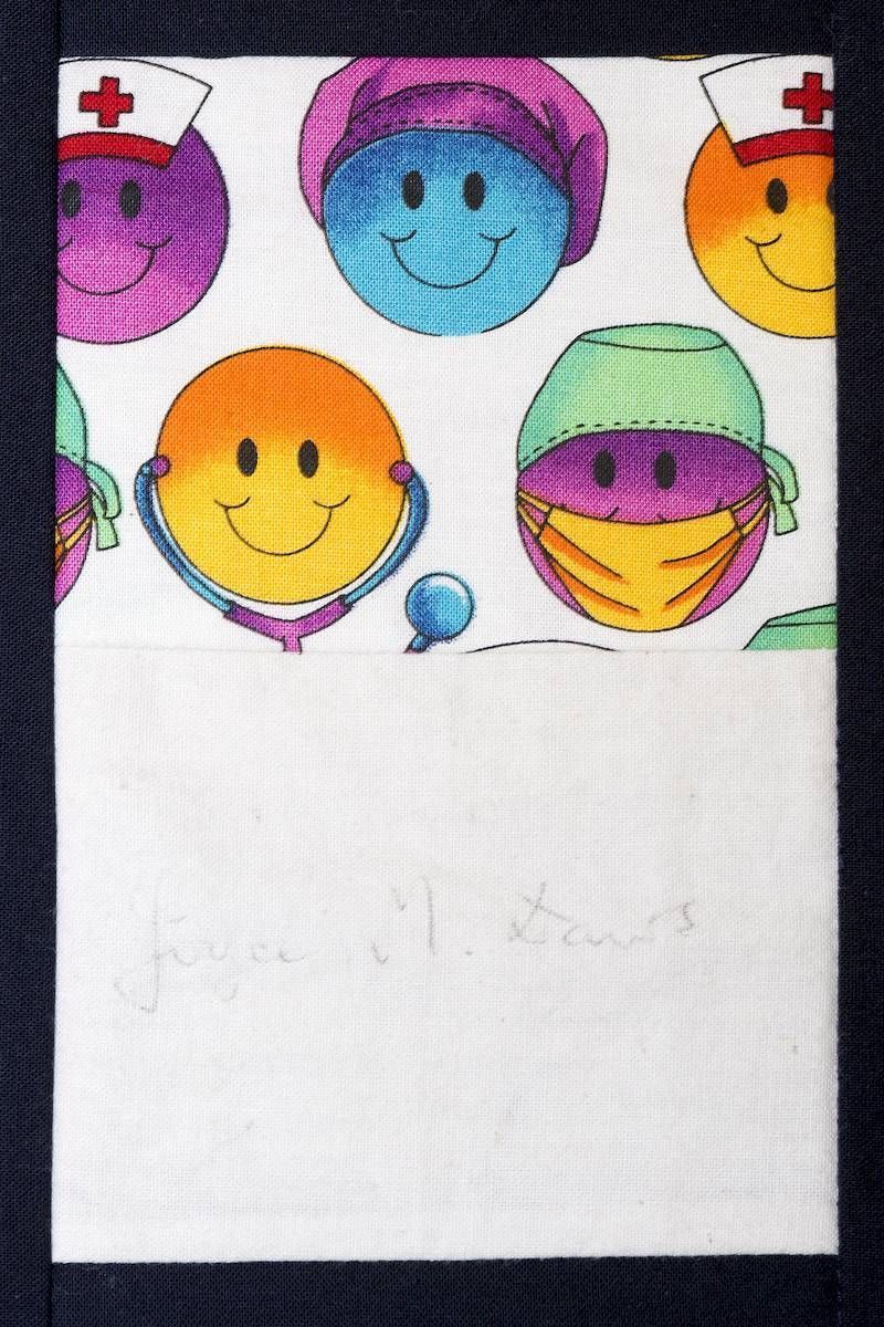 Smiling colorful cartoon faces wearing nurse hats, arranged on a white background