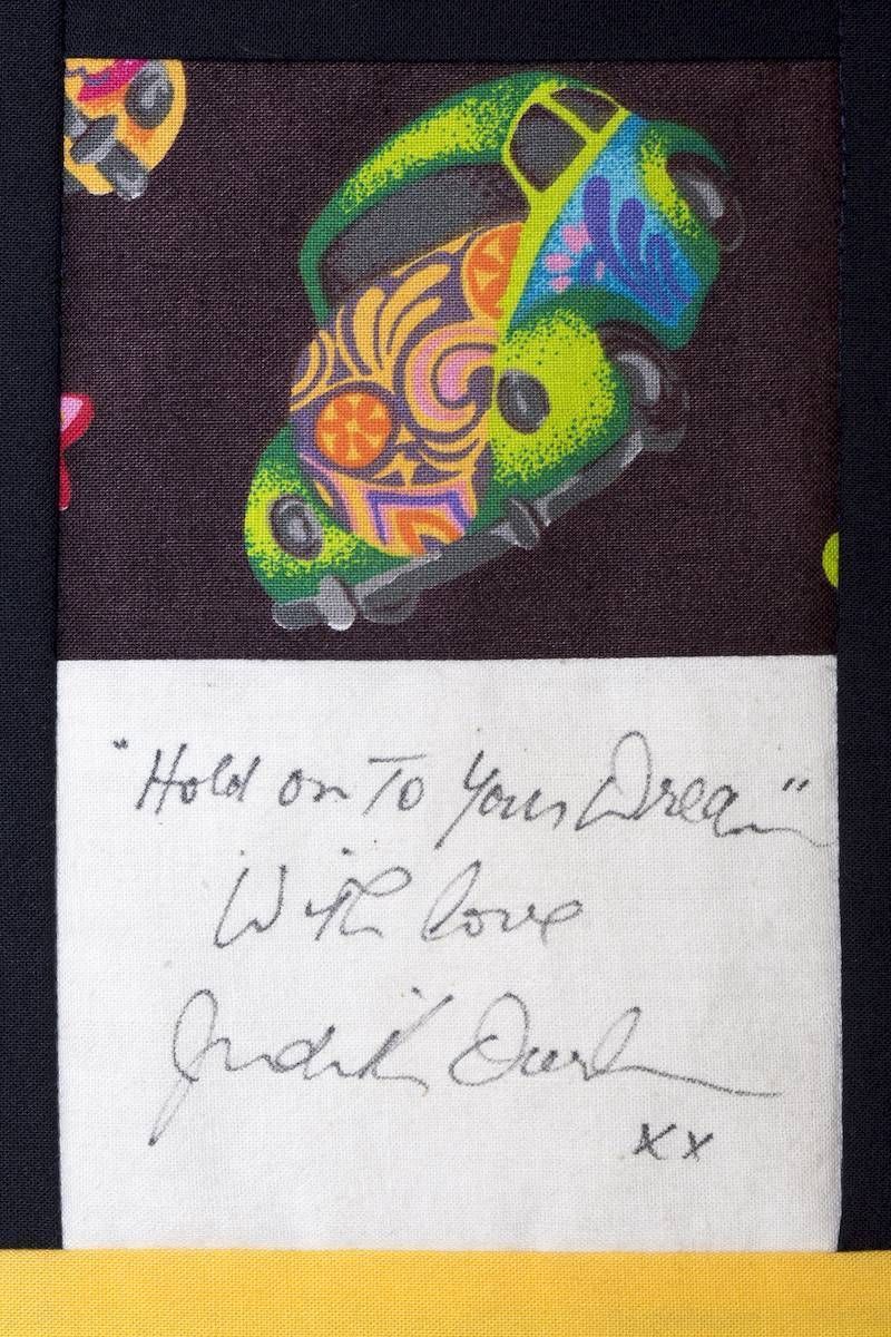 Decorated card with colorful heart art and a handwritten love message signed “xx”