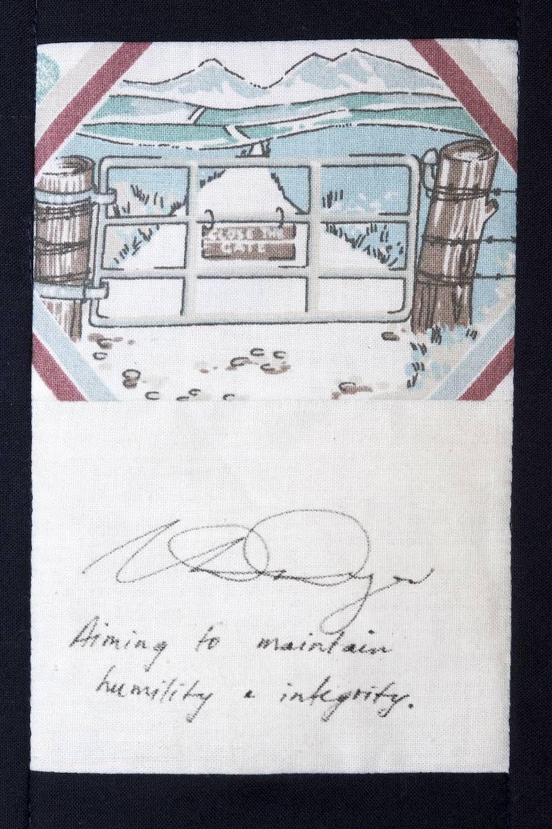 Handwritten note with a small colored drawing of a house interior and scattered objects on white paper