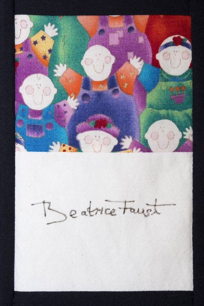 Colorful abstract crowd above a white space with handwritten text reading “Beatrice Faust”
