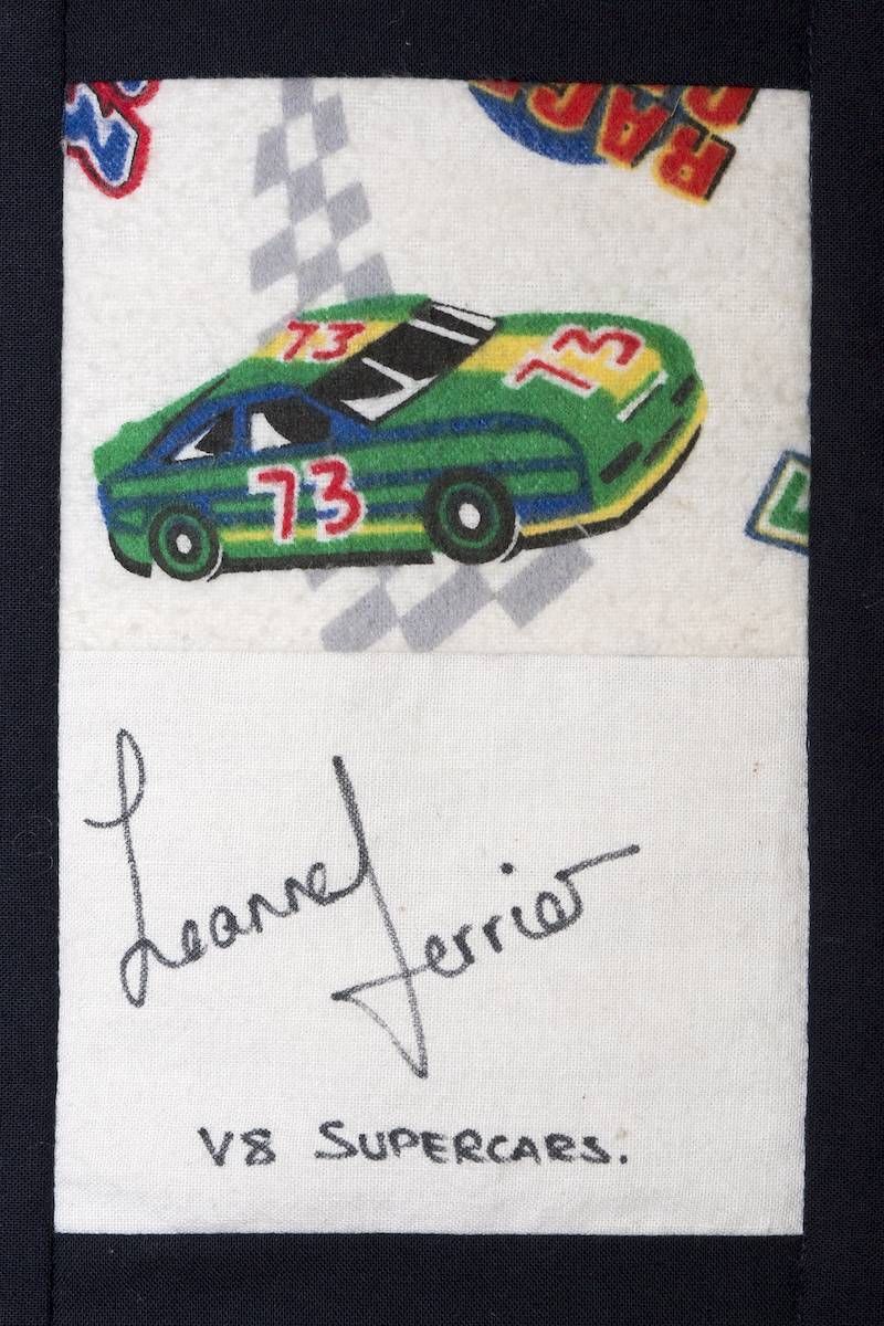 Autographed racing card with a green and black car numbered 73, signed above “VS SUPERCARS.”