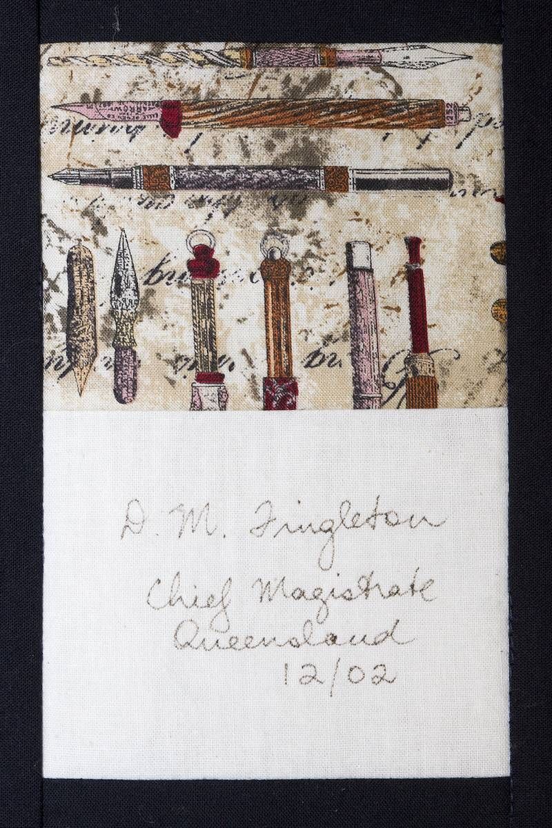 Assorted paintbrushes and tools on textured paper above a handwritten note with a date.