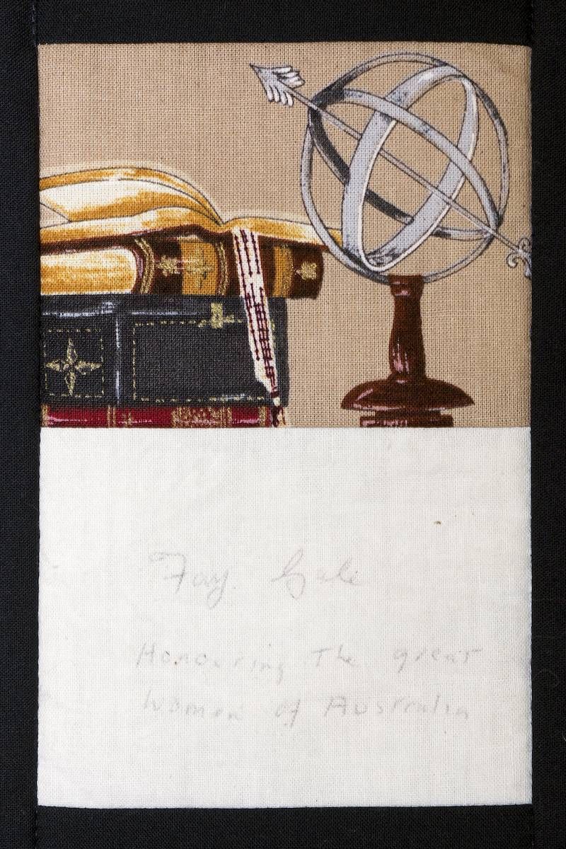 Still life sketch of books and a globe above a blank white area with faint pencil writing
