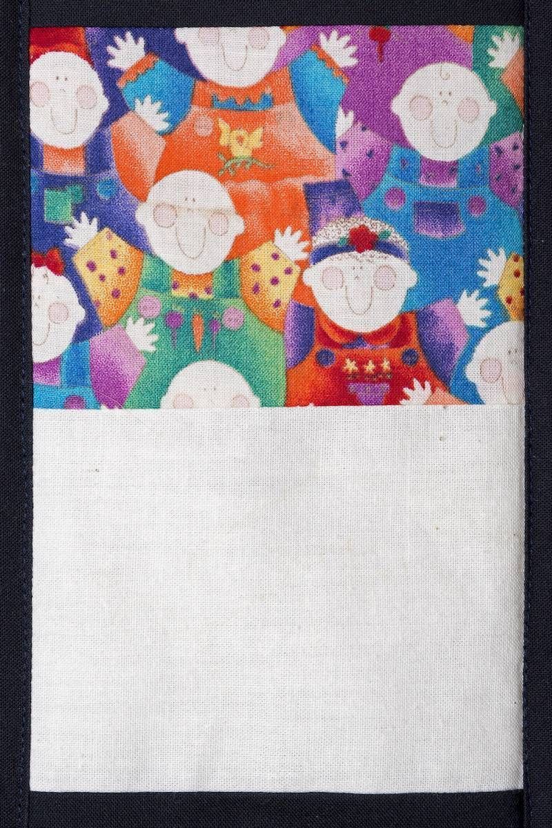 Abstract colorful pattern of owl-like figures above a large blank white space