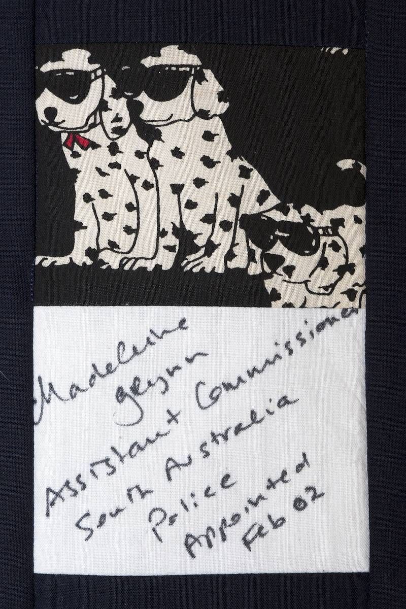 Black-and-white spotted dog illustration above a handwritten note on lined paper.