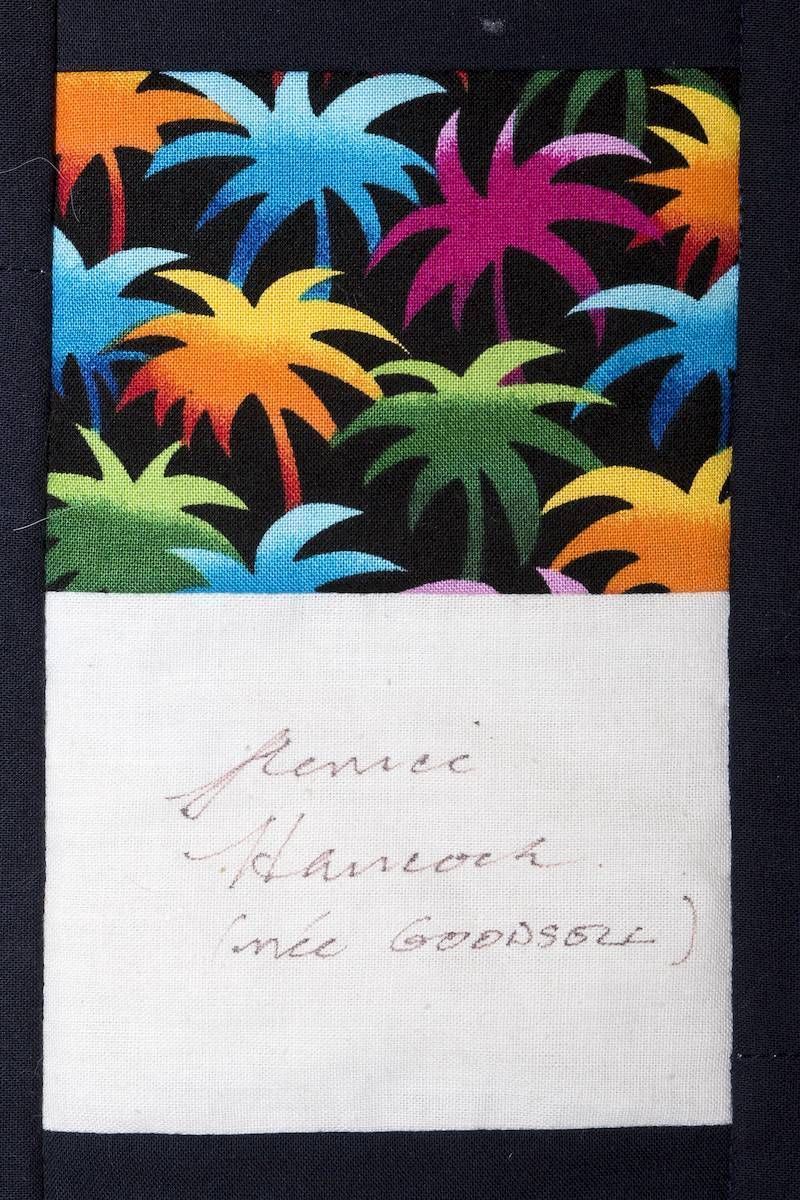 Colorful tropical leaf pattern above a handwritten note on white paper