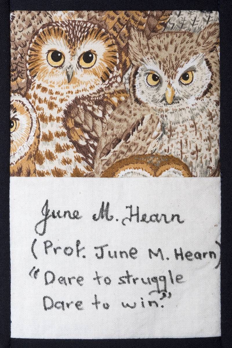 Two owls on a woven piece above a note reading, “June M. Hearn (Prof. June M. Hearn) ‘Dare to struggle / Dare to win.’”
