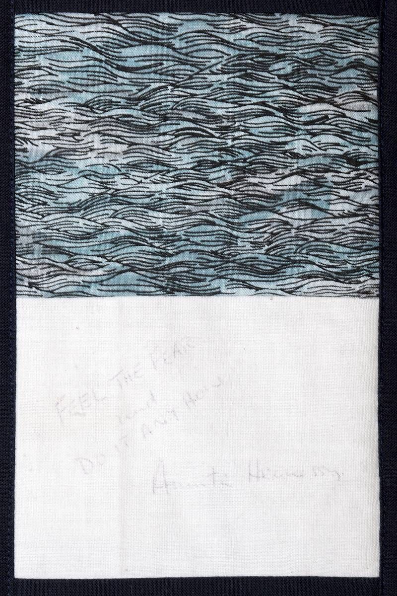 Abstract textured blue-gray pattern above a blank white section, split horizontally.