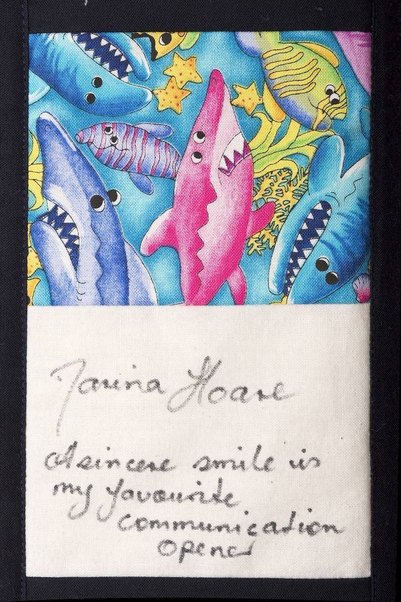 Colorful whale painting above handwritten note reading, “Genuine smile is my favorite communication tool.”