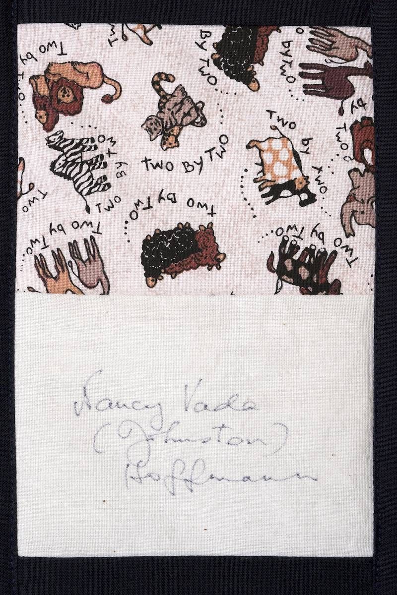 Hand-drawn cartoon animals and doodles on paper, with faint pencil writing below.