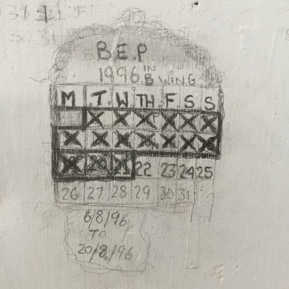Hand-drawn calendar grid on a wall with many X marks and dates written below, labeled “B.E.P 1968.”