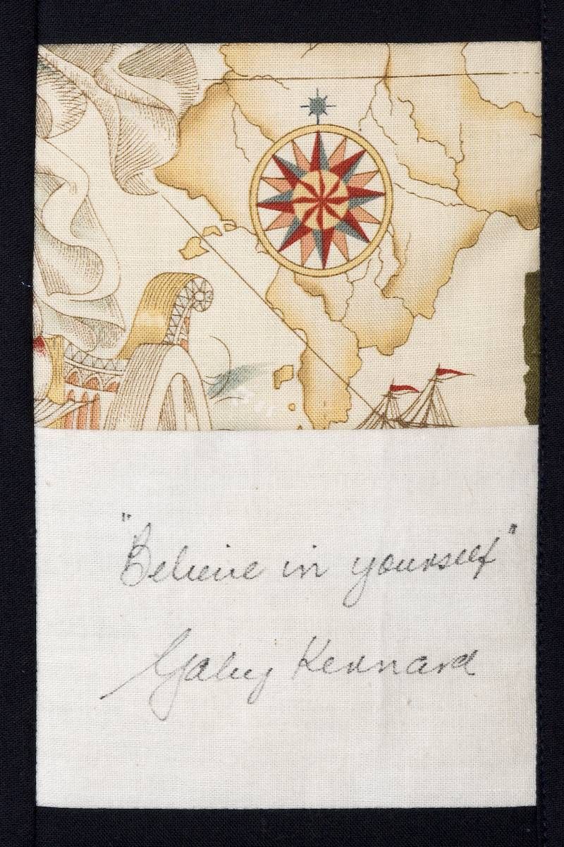 Handwritten note under a faded compass map sketch with the words “Believe in yourself. Gary Nevaar”