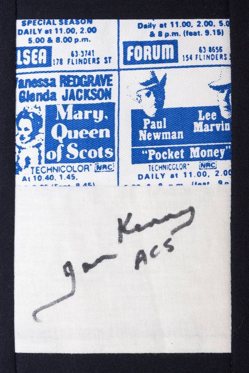 Two blue-purple concert posters above a handwritten note on white paper.
