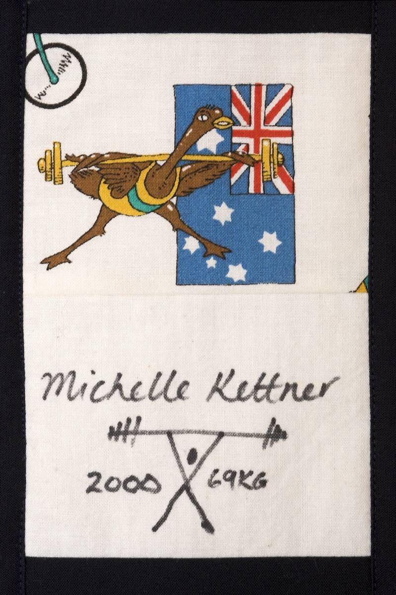 Embroidered kangaroo with Union Jack and Australian flag, signed “Michelle Kettner” and “2000 Yake.”