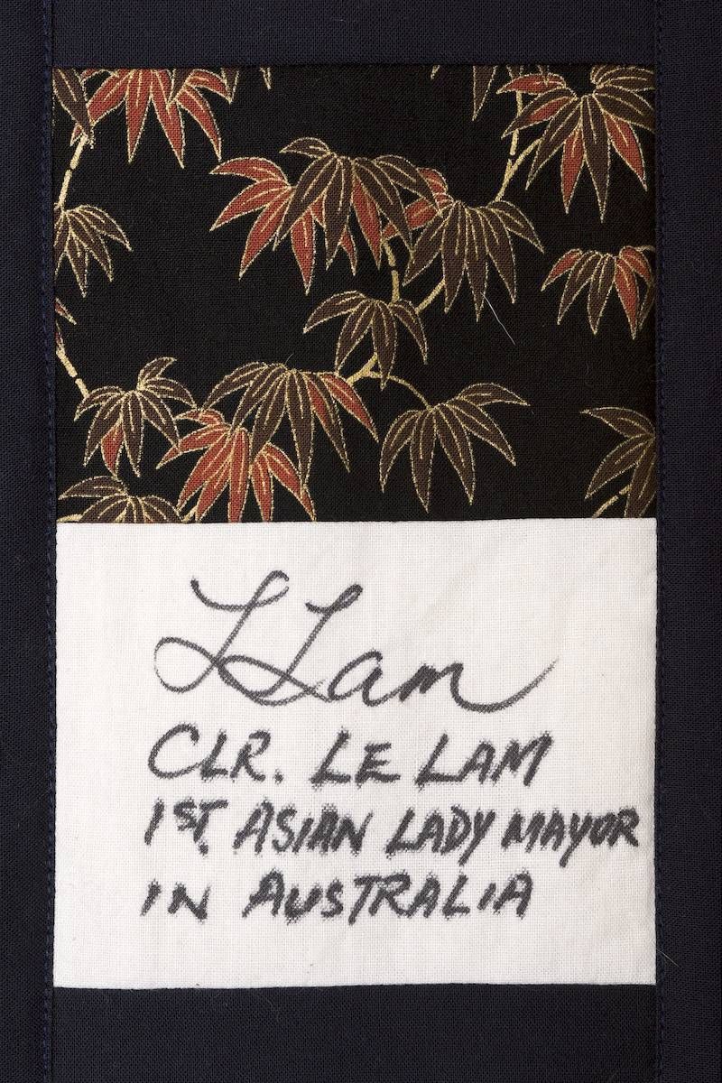 Handwritten label below dark patterned fabric with red and gold leaves reads “Lian, CK Lee Lam, an Asian lady admirer in Australia”
