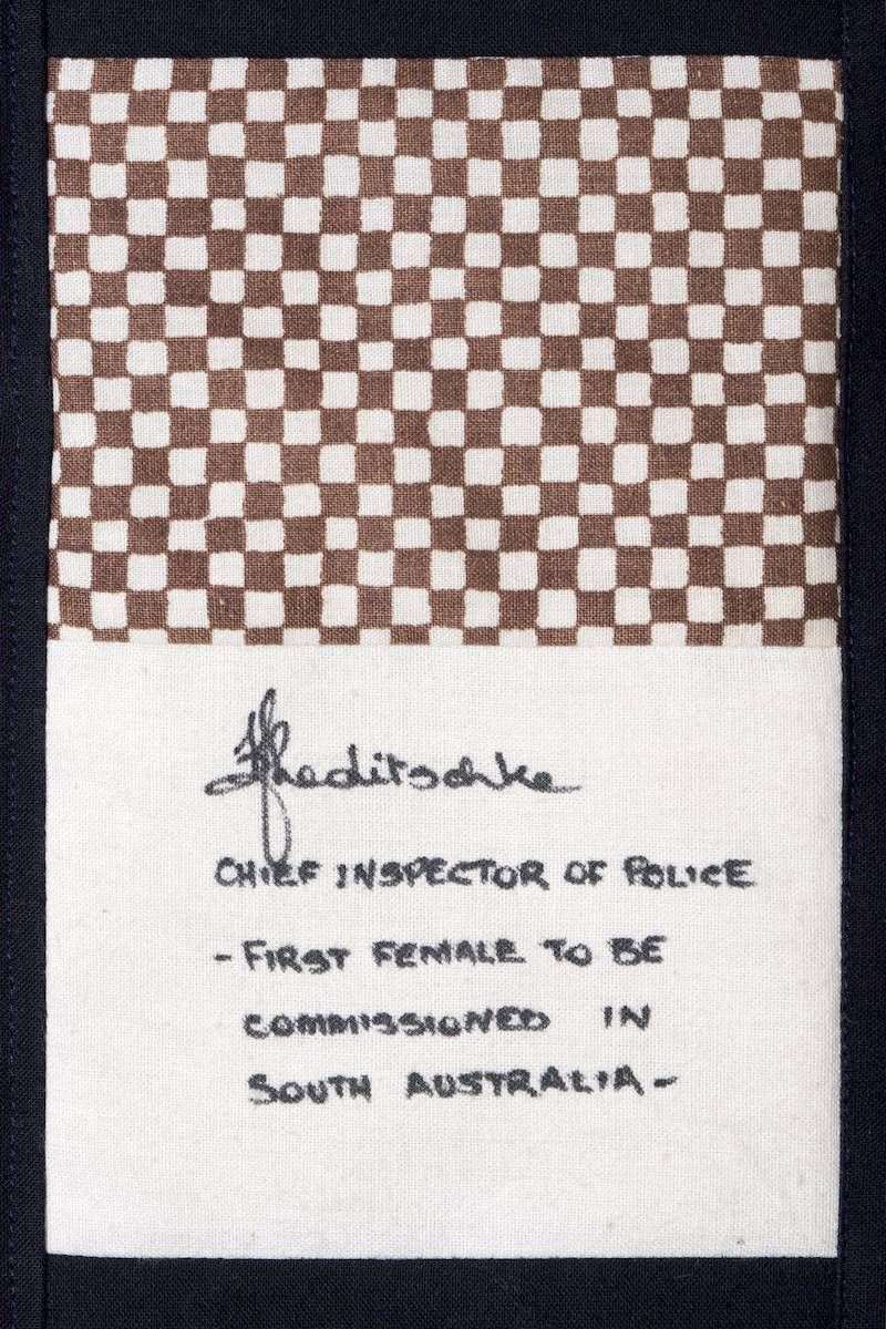 Handwritten note on checkerboard paper mentioning