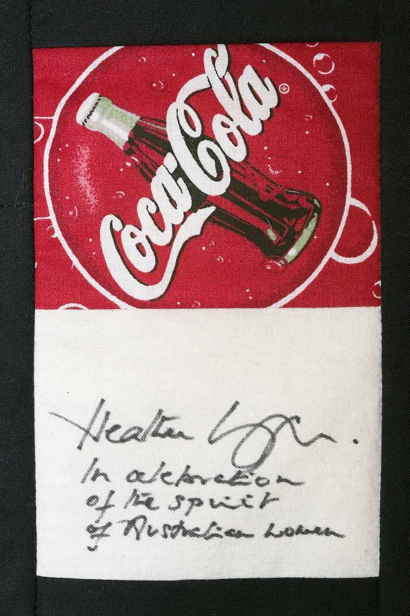 Coca-Cola logo above a handwritten note on a white background
