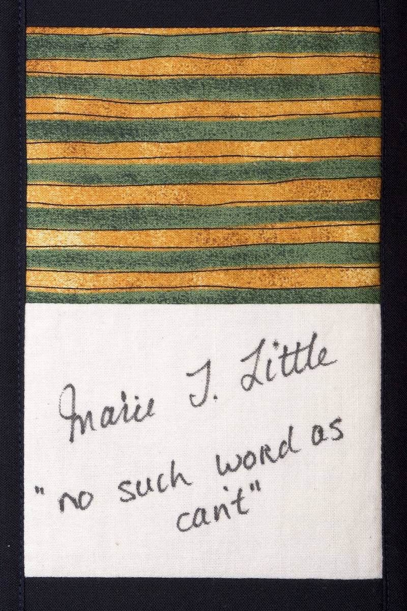 Small patch with green and gold stripes above a handwritten quote: “Marie T. Little ‘no such word as can’t’”
