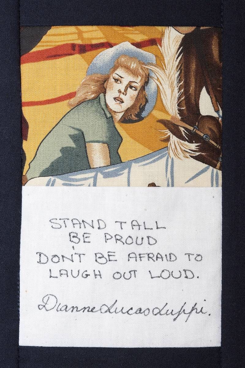 Poster of a person at a machine with the quote, “Stand tall, be proud, don’t be afraid to laugh out loud.”