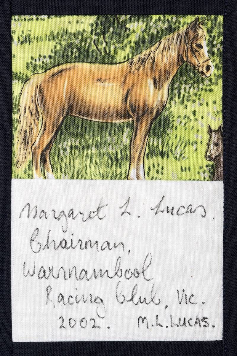 Horse standing in grass with handwritten note below, signed and dated 2002