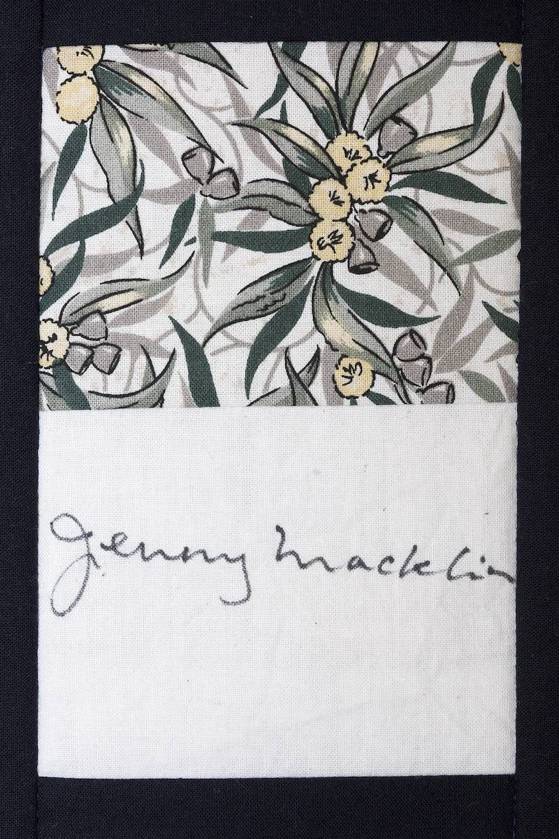 Floral fabric swatch with handwritten name label reading “Jenny Macklin”