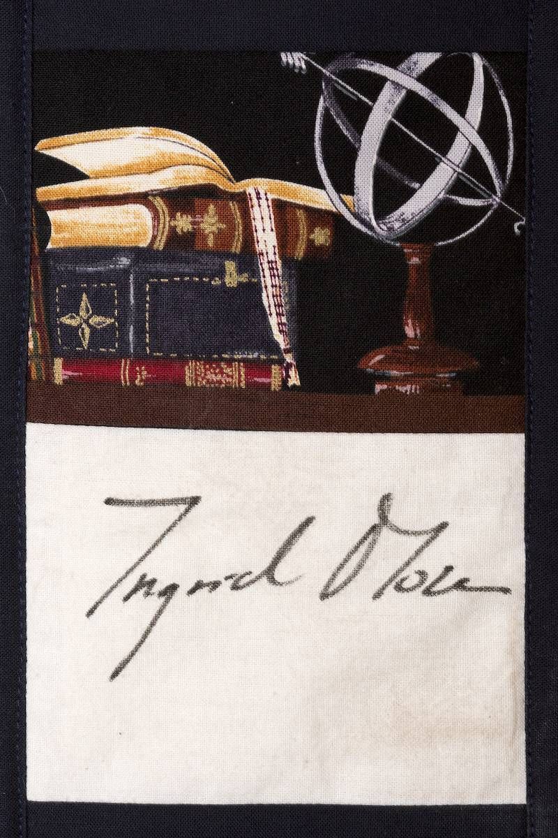 Books and an armillary sphere above the signature “Ingrid Olsen”
