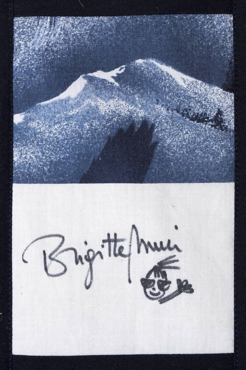 Signed black-and-white mountain print with the name “Brigitte Mir” below it.