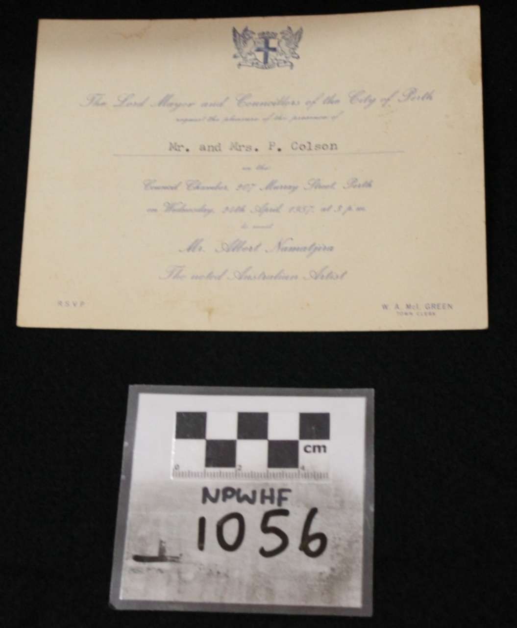 Beige handwritten note above a black-and-white evidence marker labeled NPFH 1056.
